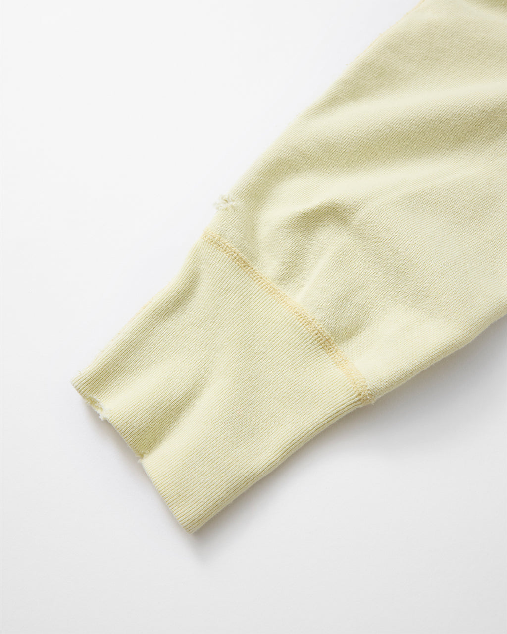 concause CREW NECK SWEAT SHIRTS / OFF WHITE 裾リブのダメージ加工ディテール
