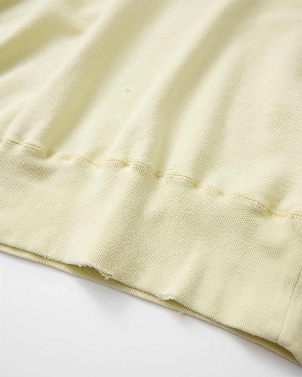 concause CREW NECK SWEAT SHIRTS / OFF WHITE 裾リブのダメージ加工ディテール（2）
